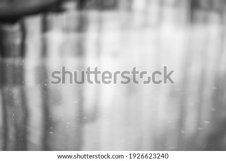 blurred abstract black and white background.