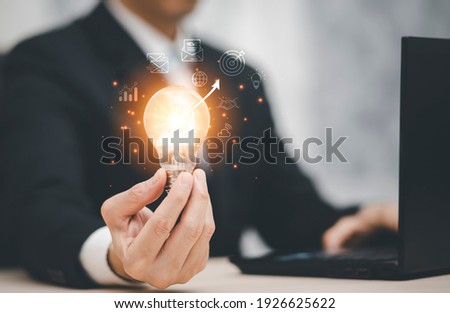 thinking and creative concept, Close up the light bulb and working on the desk, Creativity, and innovation are keys to success,  new idea and innovation with Brain and light bulbs, working at home