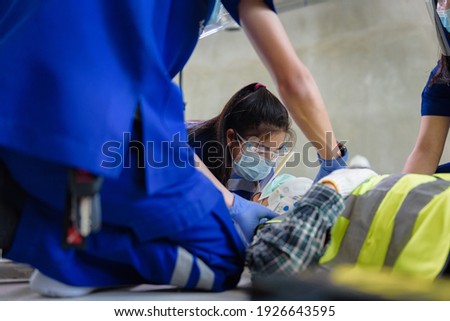 First aid for head injuries and Considered for all trauma incidents of worker in work, Loss of feeling or loss of normal movement and Loss of function in limbs, First aid training to transfer patient. Royalty-Free Stock Photo #1926643595