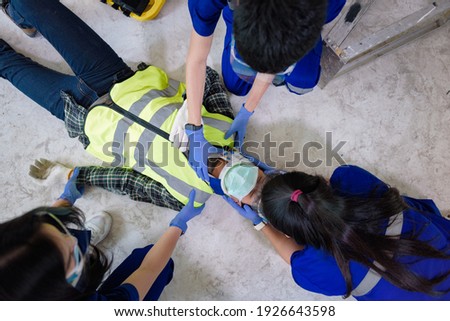 First aid for head injuries and Considered for all trauma incidents of worker in work, Loss of feeling or loss of normal movement and Loss of function in limbs, First aid training to transfer patient. Royalty-Free Stock Photo #1926643598