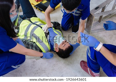 First aid for head injuries and Considered for all trauma incidents of worker in work, Loss of feeling or loss of normal movement and Loss of function in limbs, First aid training to transfer patient. Royalty-Free Stock Photo #1926643601