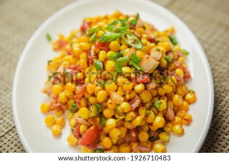 Spicy Sweet Corn Chaat in indian style served on a plate. Sweet Corn recipe Royalty-Free Stock Photo #1926710483