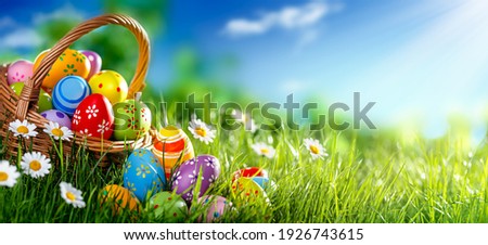 Easter eggs decorated with flowers in the grass Royalty-Free Stock Photo #1926743615