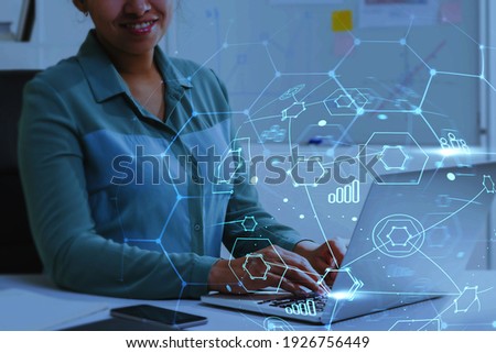 Young business woman in shirt working using laptop. Abstract office and graph background with double exposure. Concept of HR and social media networking. Toned image