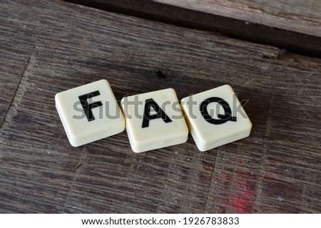 Selective focus with noise effect square letters with text FAQ.