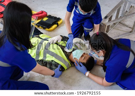 First aid for head injuries and Considered for all trauma incidents of worker in work, Loss of feeling or loss of normal movement and Loss of function in limbs, First aid training to transfer patient. Royalty-Free Stock Photo #1926792155