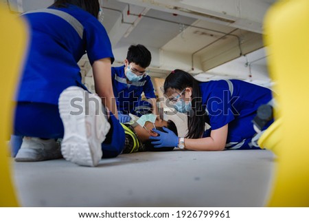 First aid for head injuries and Considered for all trauma incidents of worker in work, Loss of feeling or loss of normal movement and Loss of function in limbs, First aid training to transfer patient. Royalty-Free Stock Photo #1926799961