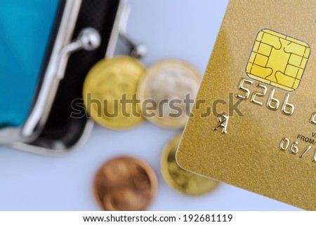 a golden credit card and an empty wallet. symbolic photo for cashless purchases and status symbols.
