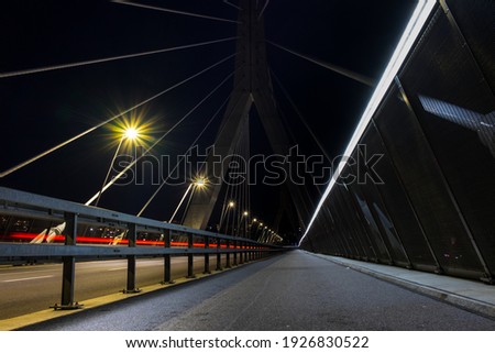Long exposure view of the Poya Bridge with vehicle light trails in the background. Shot in Fribourg, Switzerland