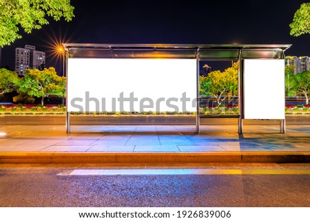 Night shot of a luminous advertising lightbox or display at a bus stop in Shanghai,China.