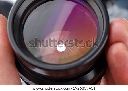 close-up view of black large format photographic lens with closed iris aperture unit with 20 blades