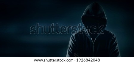 Cybersecurity, computer hacker with hoodie Royalty-Free Stock Photo #1926842048