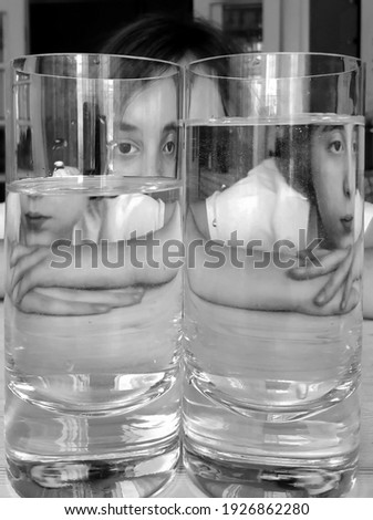 Girl with two glasses of water. Optical imaging. High quality photo
