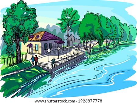 Town embankment on a summer day. The house and trees are illuminated by the bright sun. People are walking.