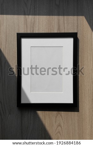 Black minimal picture frame,Portrait frame,Mockup frame,Photo frame, on wood background