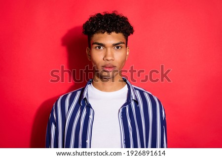 Photo of young handsome black man serious confident calm wear casual outfit isolated over red color background