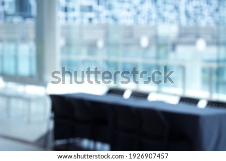 Business-style blurred background with table scenes and word-fill space.