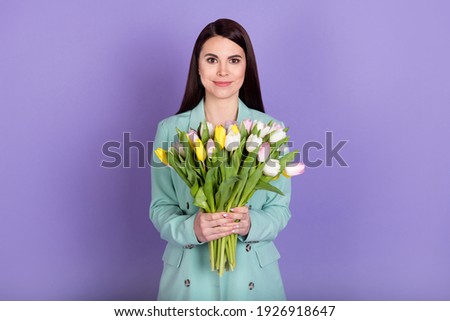 Photo of young happy beautiful lovely sweet businesswoman hold bouquet woman day isolated on violet color background