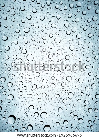 Rain Drops Background Texture on a cloudy day. Picture is looking through the surface of a sunroof. Could also have the look of underwater bubbles.