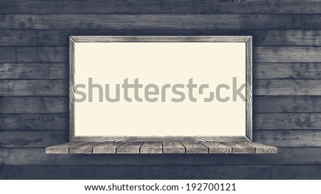 Blank Frame on Vintage Wood Background