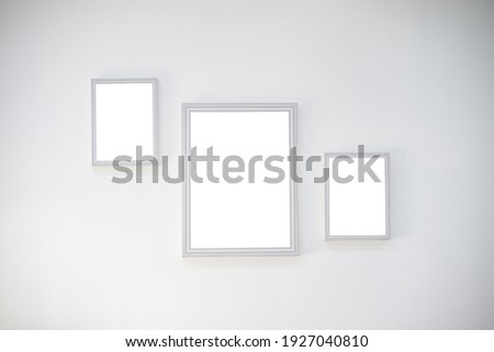 Blank white mock up on white wall 