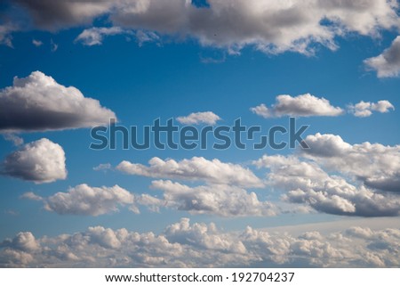 Beautiful fluffy clouds in the blue sky background.