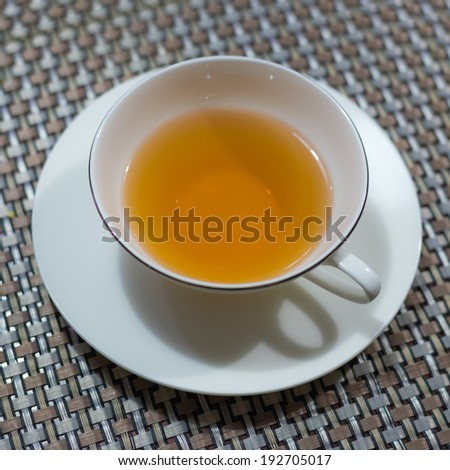 Cup of black tea on the table ready to drink.