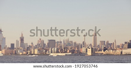 Manhattan panorama at sunset, color toned picture, New York City, USA.