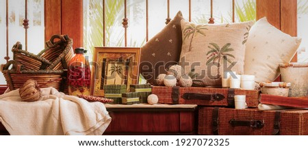 Home Decor. Still life of home products, such as pillows, trunks, baskets, candles and candle holders, table cloths, picture frames, and more. Royalty-Free Stock Photo #1927072325