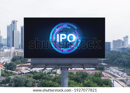 IPO icon hologram on road billboard over day time panorama city view of Kuala Lumpur. KL is the hub of initial public offering in Malaysia, Asia. The concept of exceeding business opportunities.