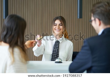 Receptionist working in a hotel Royalty-Free Stock Photo #1927088357