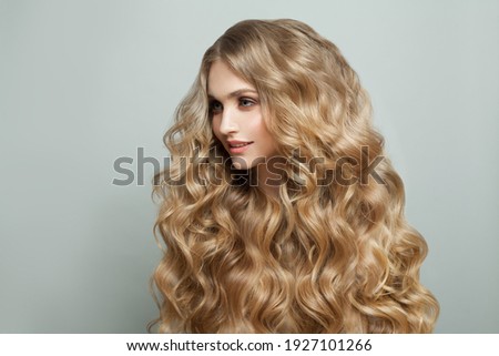 Smiling woman fashion model with long healthy hairstyle on white background