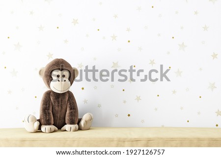Frame mockup plush monkey on a starry background.