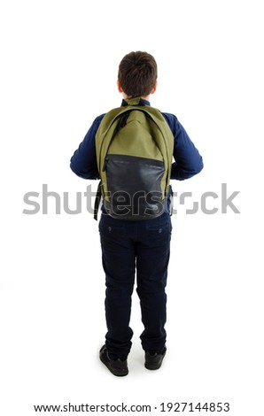 
Back to school concept. Adorable schoolboy with backpacks looking at wall. Back view. Isolated on white background. Full length. Modern teenage boy with backpack looking at wall. Royalty-Free Stock Photo #1927144853