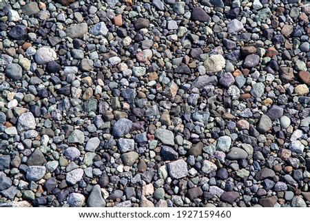 A detail picture with shallow depth of fiield of various stones of different shapes and colours