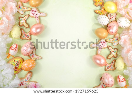 Happy Easter concept, spring card, composition with flowers, cookies and eggs on a gentle background. Festive minimal concept, home baking ideas, place for text, banner for screen, selective focus