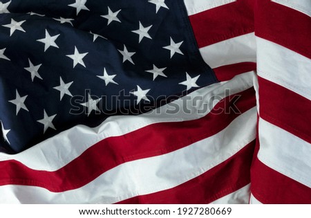 Stars displaying on waving American flag in filled frame layout 
