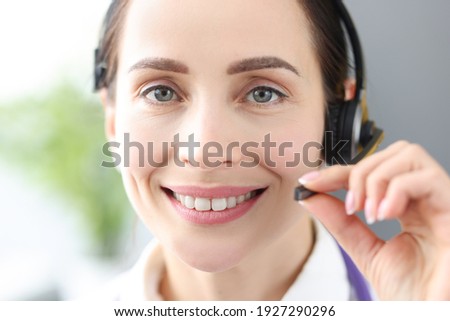 Portrait of smiling doctor operator in call center. Remote medical assistance doctors consultants concept