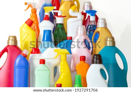A lot of bottles with chemicals for cleaning. Different plastic bottles in the form of mountain. Pile of many colorful bottles on the white background Royalty-Free Stock Photo #1927291706