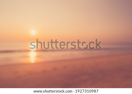 Tropical beach with smooth wave and sunset sky abstract background. Copy space of business summer vacation and travel adventure concept. Vintage tone filter effect color style.