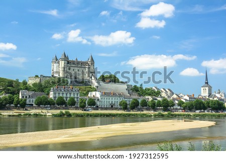 View on Loire river and  Castle (Chateau) of Saumur  on a sunny day with beautiful clouds Royalty-Free Stock Photo #1927312595