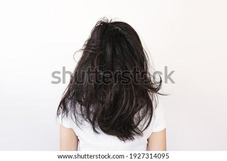 Messy damaged long black hair, on white background Royalty-Free Stock Photo #1927314095