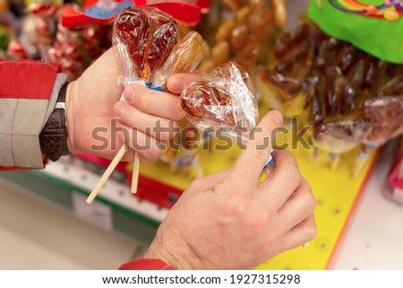the Christmas sweets, lollipops, candy in hand