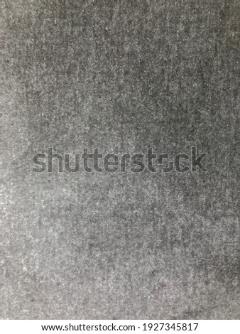 A black and white background image lit from the bottom corner.