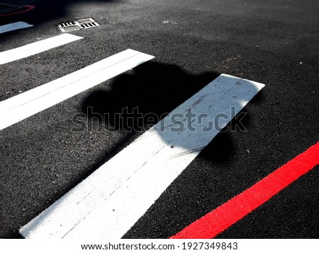 Asphalt road with marking lines white stripes texture. Zebra crossing, pedestrian crosswalk on asphalt road