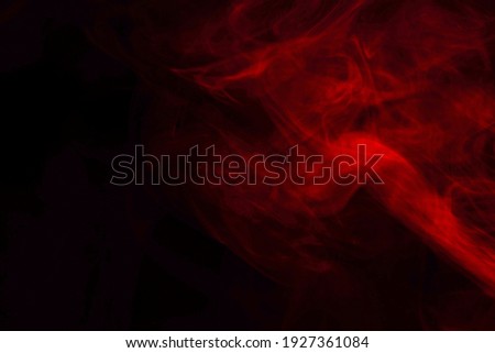 Red steam on a black background. Copy space. Royalty-Free Stock Photo #1927361084