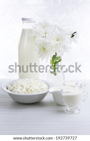 Tasty dairy products on wooden table