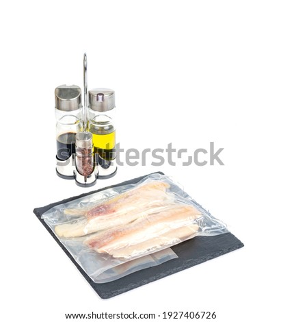 Packaging of frozen fillets of white fish, pollock. Studio Photo