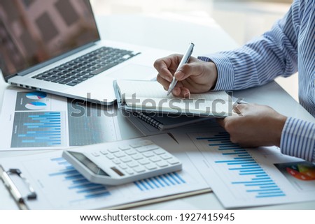 Audit concept,Administrator business man financial inspector and secretary making report calculating balance. Internal Revenue Service checking document. Royalty-Free Stock Photo #1927415945