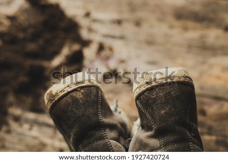Closeup shot of dirty children's boots . High quality photo